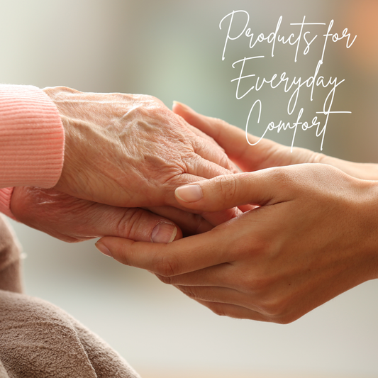 Two hands, one elderly and one younger, holding each other with a soft focus background and text 'Products for Everyday Comfort'.