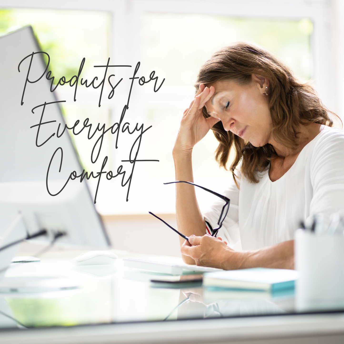 Woman sitting at a desk with text 'Products for Everyday Comfort' in a bright room.